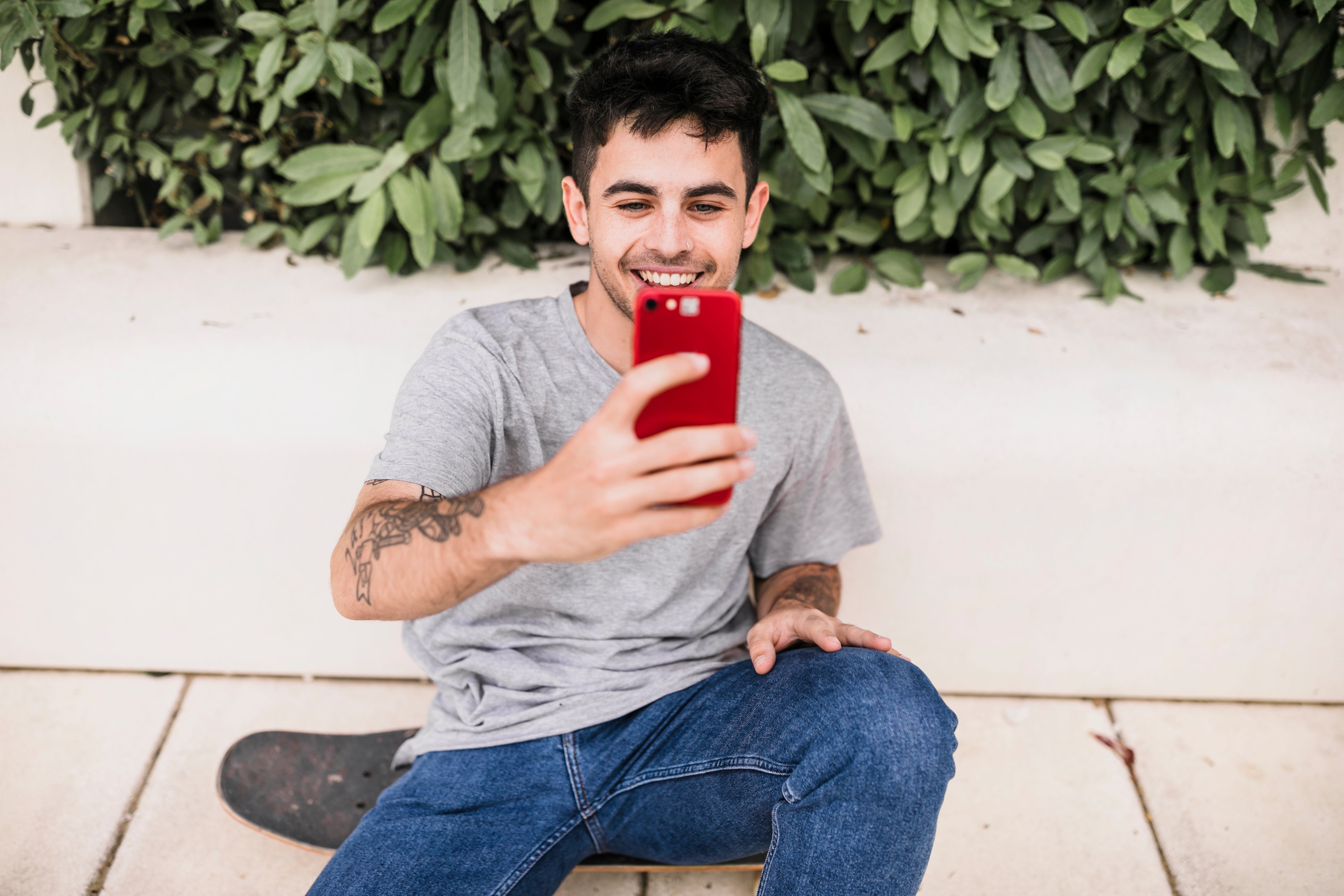 files/close-up-boy-taking-selfie-with-his-red-mobile-phone.jpg
