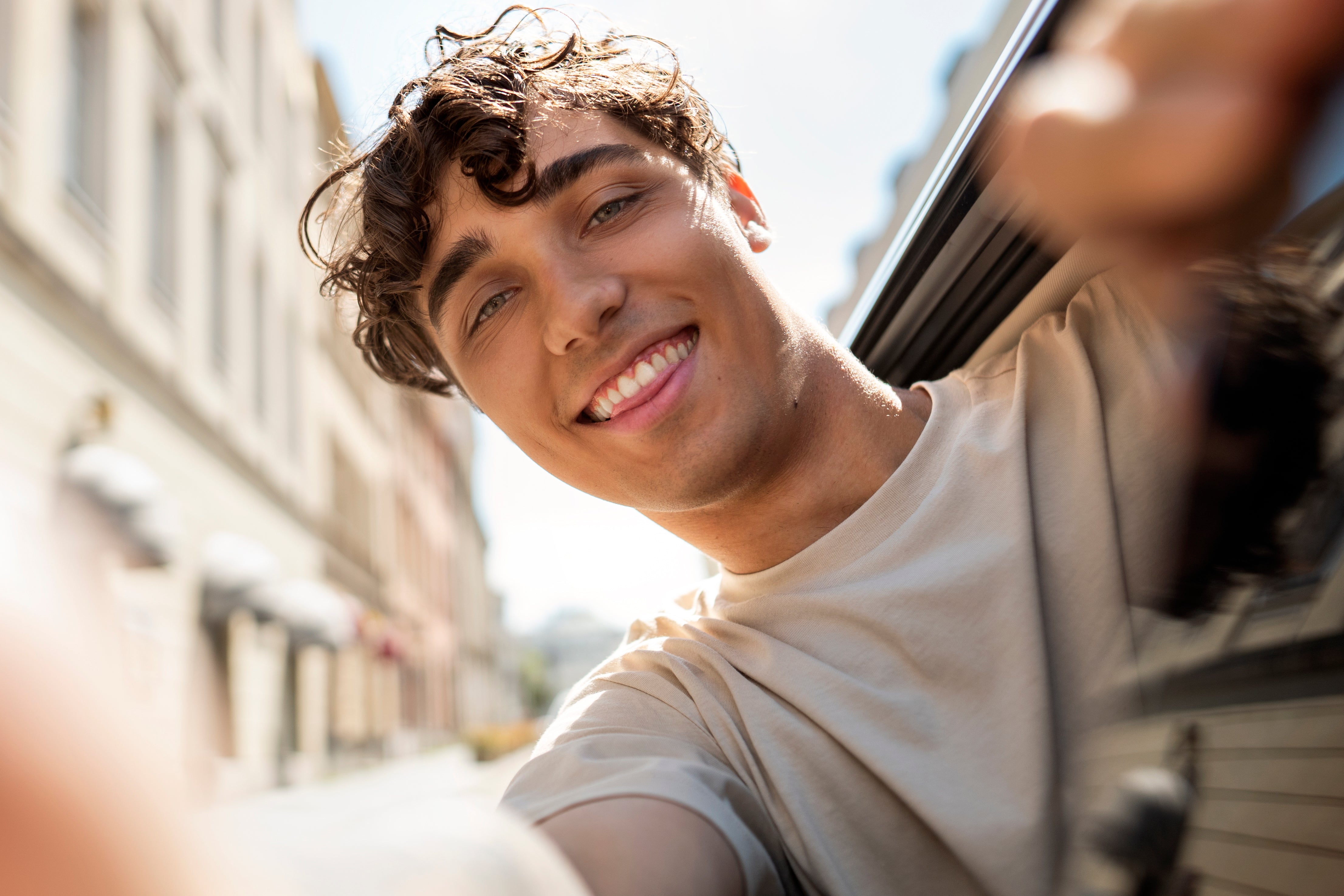 files/low-angle-smiley-man-posing.jpg